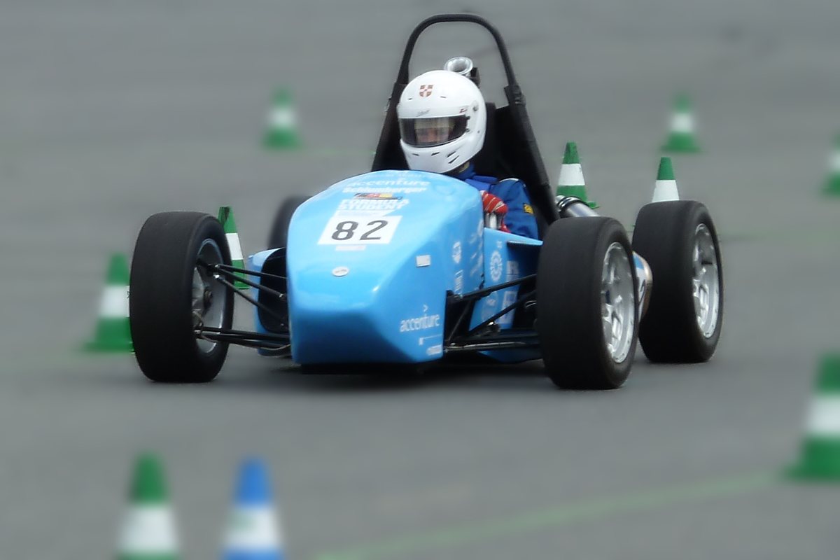 Formula Student car number 82 on a cone course