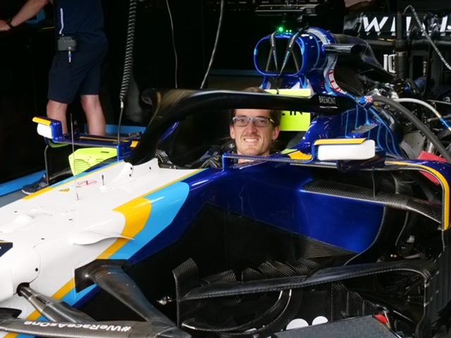 James Crook sitting in the cockpit of a Williams Formula 1 car